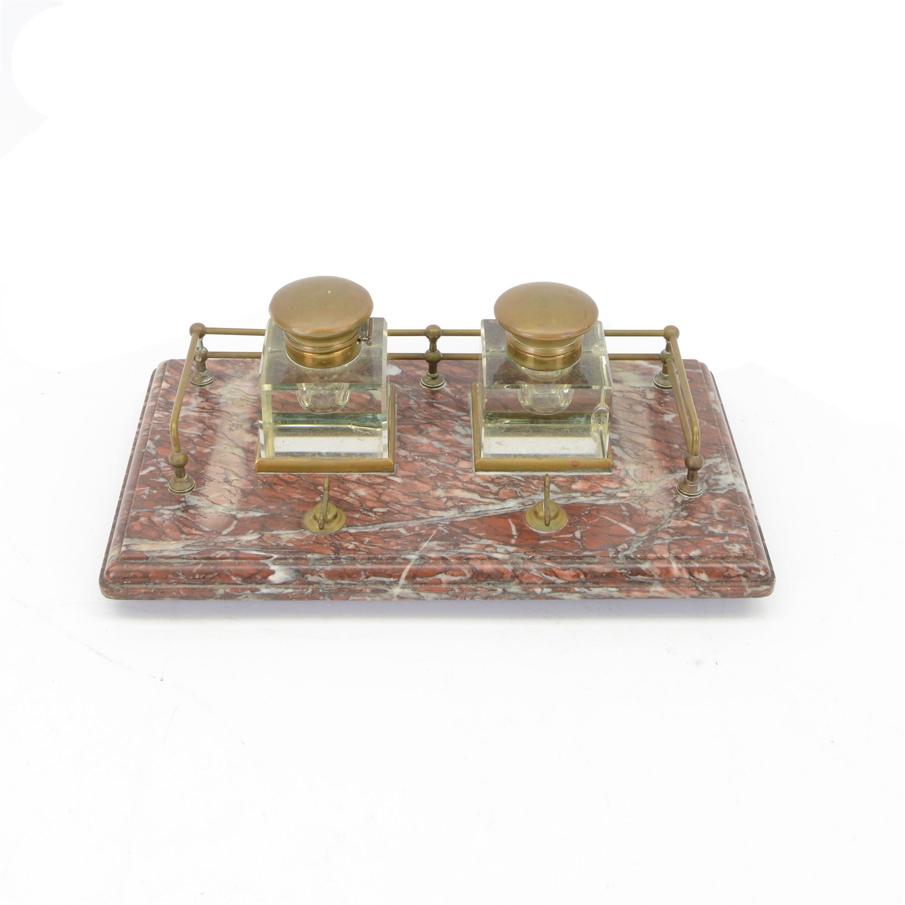 Victorian brass metal mounted red marble inkstand, the stepped rectangular base raised upon bun feet, complete with two glass ink bottles with hinged lids, H12cm