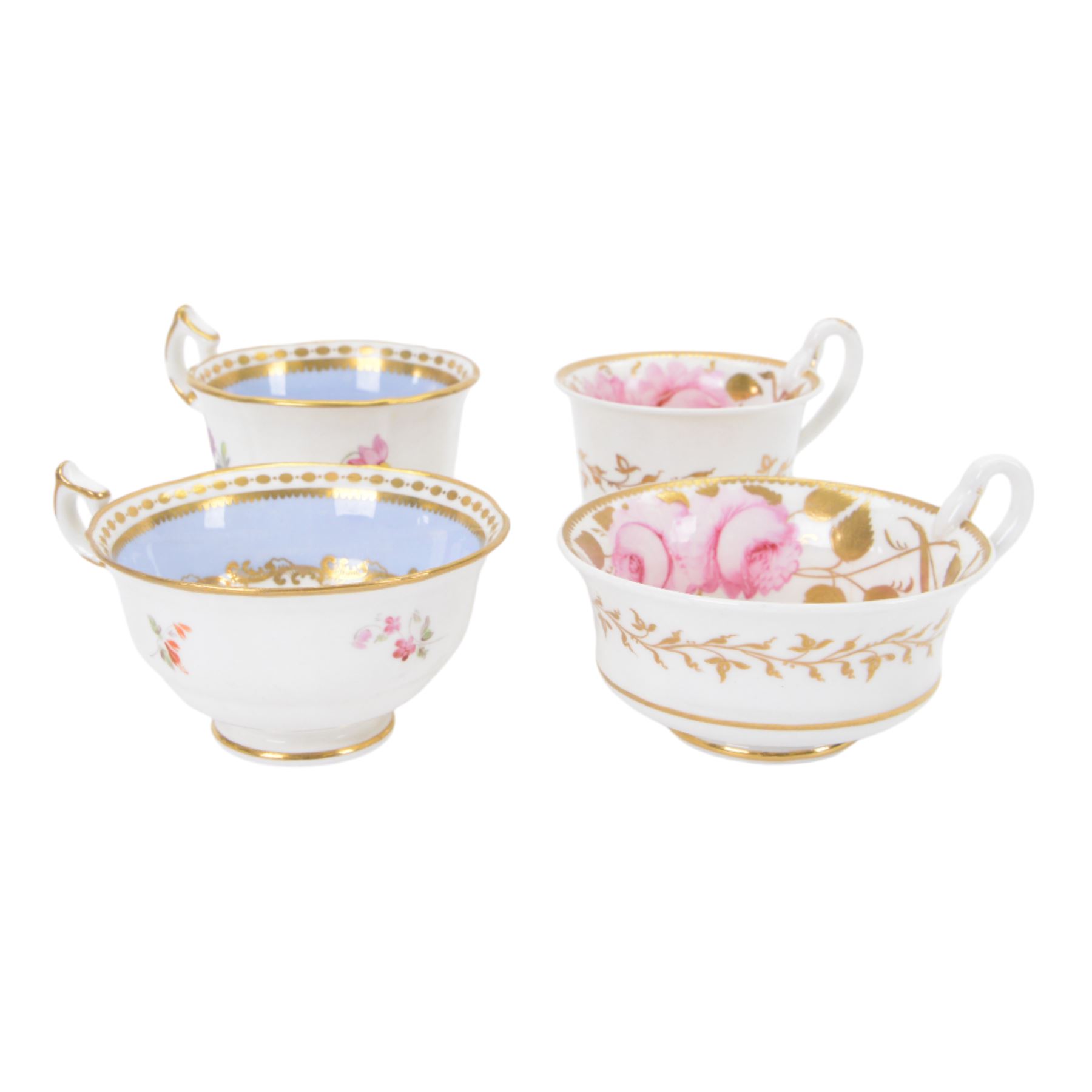 Minton trio, coffee cup, teacup and saucer, circa 1824, moulded ribbed detail, distinctive 'N' handle, painted in pattern no 139, with floral sprays and lilac blue band, coffee cup including handle H8cm, saucer D14cm, together with a Spode trio, coffee cup, teacup and saucer, circa 1830, decorated in the 3886 pattern, painted with pink cabbage roses and heightened with gilt, coffee cup including handle H8cm, saucer D15cm