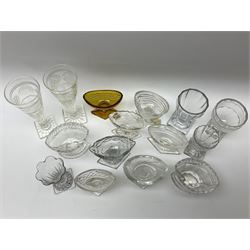 A group of 19th century drinking glasses, to include two examples with lemon squeezer base, a pair with cut and faceted funnel bowls, plus a selection of mostly 19th century cut glass salts of navette or boat form. 