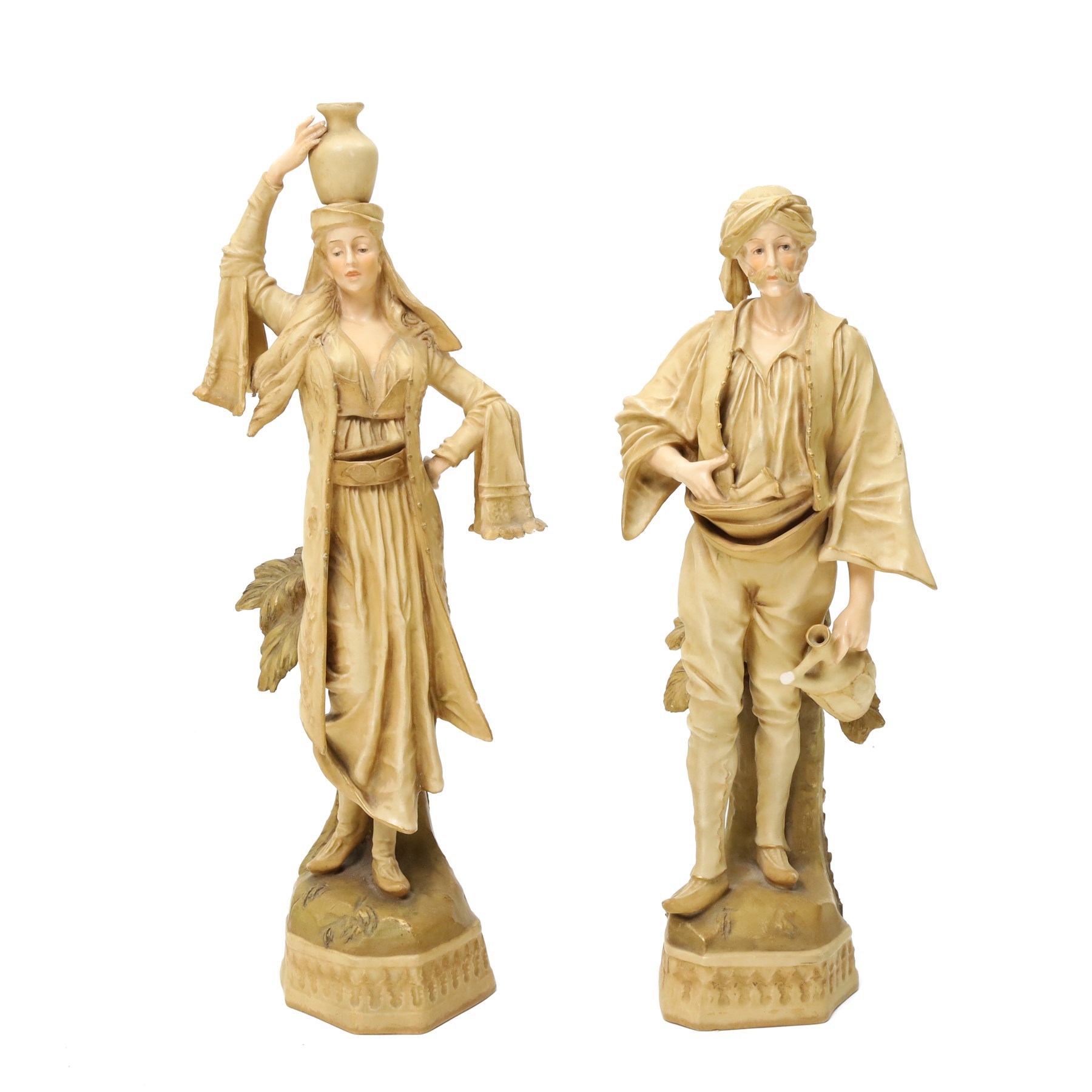 Pair of Ernst Wahliss for Turn Wien porcelain figures of Middle Eastern water carriers, taller figure H35cm