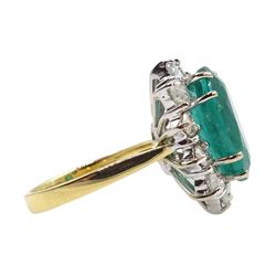 18ct gold oval Zambian emerald and round brilliant cut diamond cluster ring, hallmarked, emerald approx 5.80 carat, total diamond weight approx 1.00 carat