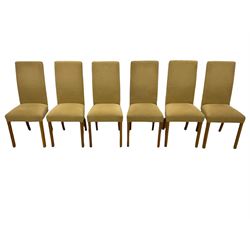 Light oak extending dining table, with leaf, and six high back upholstered chairs