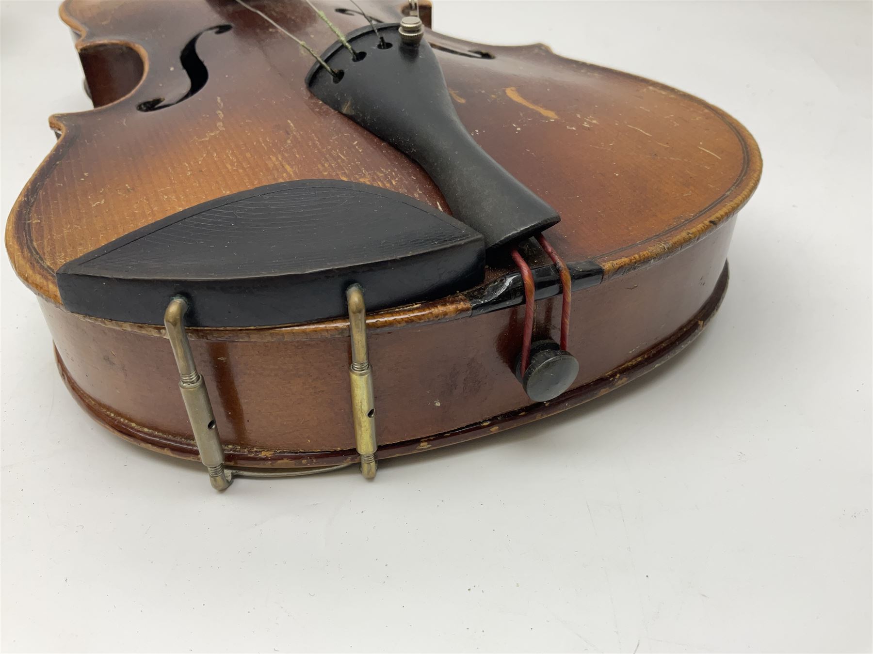 Czechoslovakian violin c1920 with 36cm two-piece maple back and ribs and spruce top, bears label 'Copy of Antonius Stradivarius Made in Czechoslovakia' L59cm; in carrying case; 1950s Czechoslovakian violin; and 195os Czechoslovakian three-quarter size violin; both cased (3)