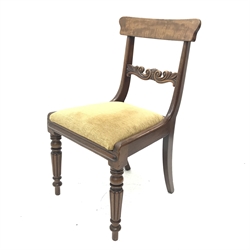 Set five early 19th century mahogany dining chairs, figured back rests above scroll and leaf carved rails, upholstered drop in seat cushions, raised on Gillows style turned and lobe carved supports