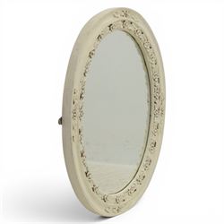 Oval painted pine wall mirror, with carved stepped edge, with mounts for hanging