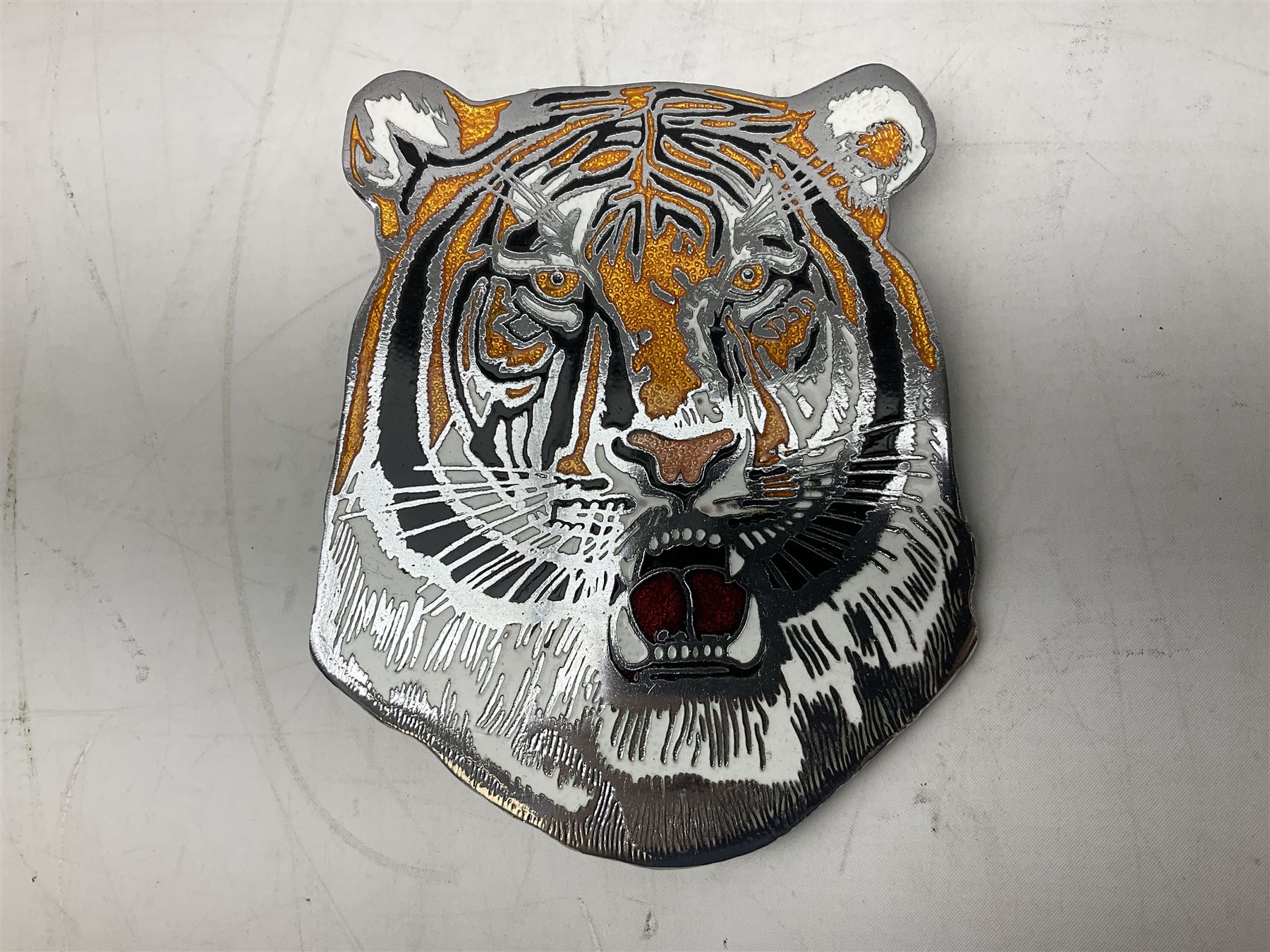 Leyland Royal Tiger enamelled metal sign of a tiger's head marked Manhattan Windsor Birmingham England no. NLH 960 to reverse, L16cm, together with a keyring and Leyland bus navy tie 