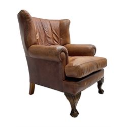 Tetrad - 'Blake' club armchair, fanned wingback and rolled arms upholstered in tan brown leather, on ball and claw carved cabriole feet 