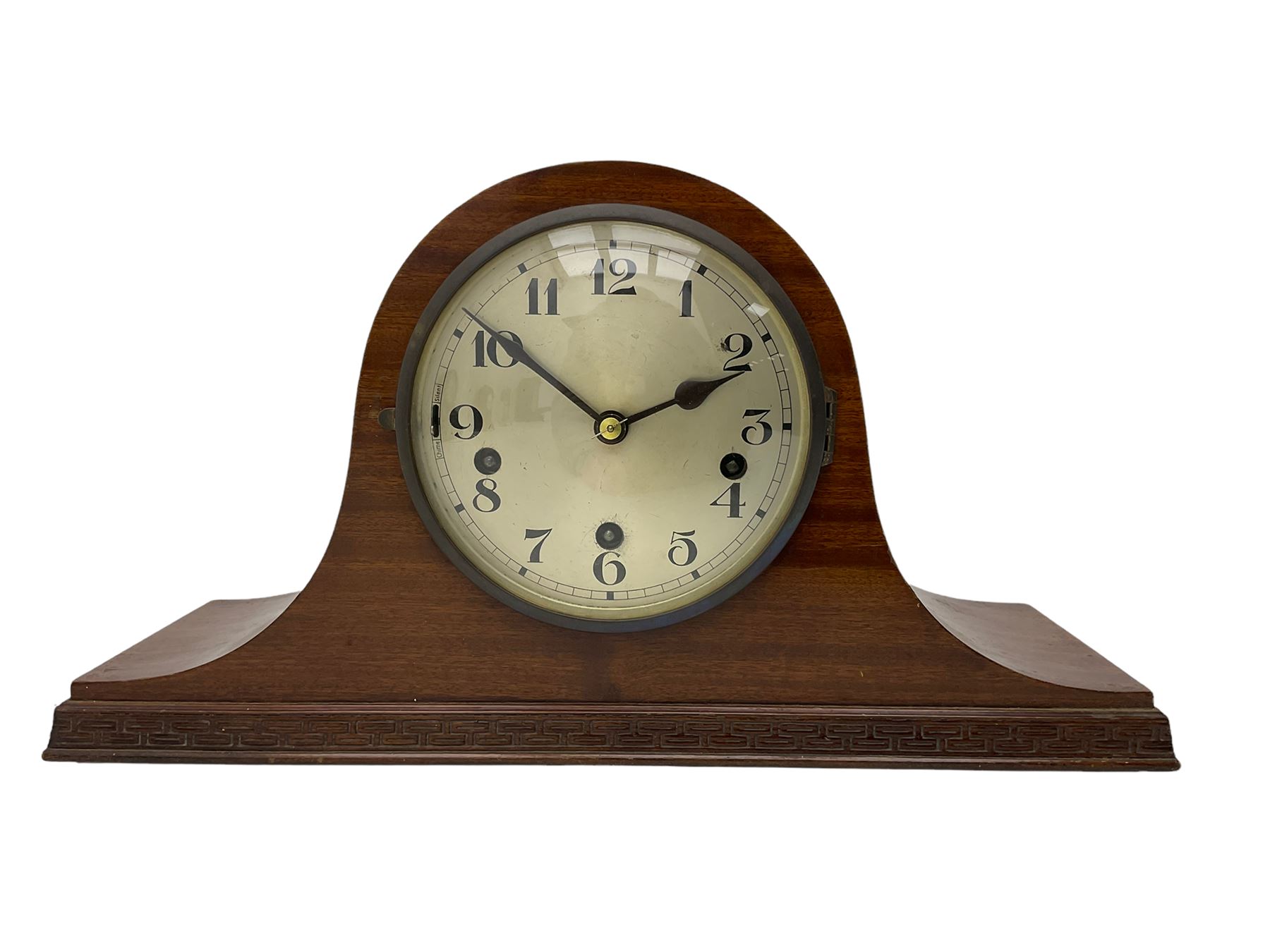 Sapele Mahogany cased tambour mantle clock c1950 with a three-train chiming movement, chiming the quarters on 5 gong rods, with a silvered dial, Arabic numerals, minute track and steel spade hands, strike/silent facility. With pendulum.




