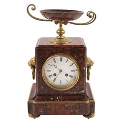 Neo-Classical red marble clock garniture, eight day movement, with urn top and lion mask handles, H34cm
