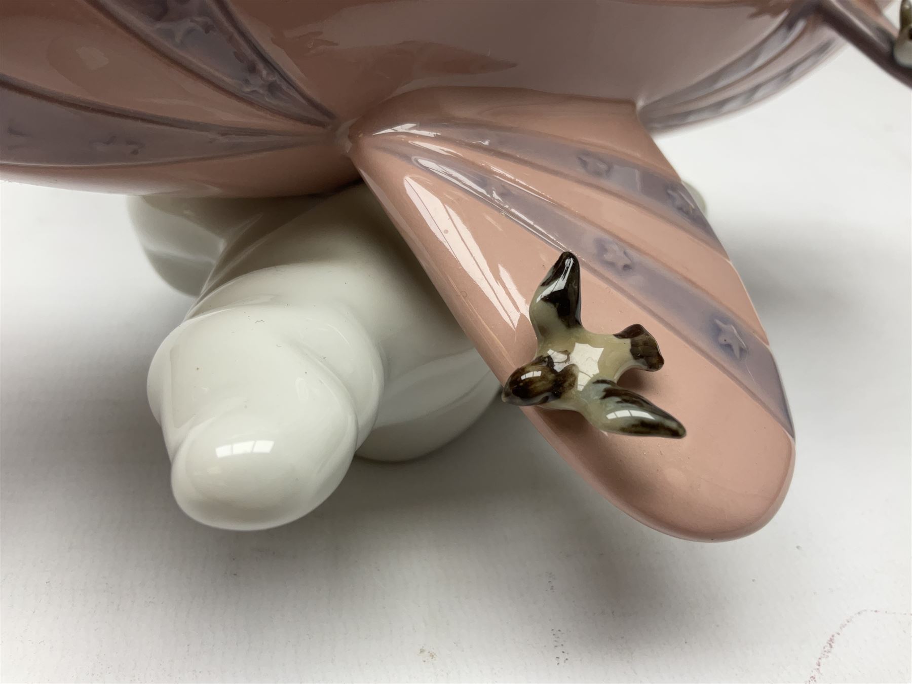 Lladro figure, Don't Look Down, modelled as a girl and boy in a plane, sculpted by Joan Coderch, no 5698, year issued 1990, year retired 2004, H17cm