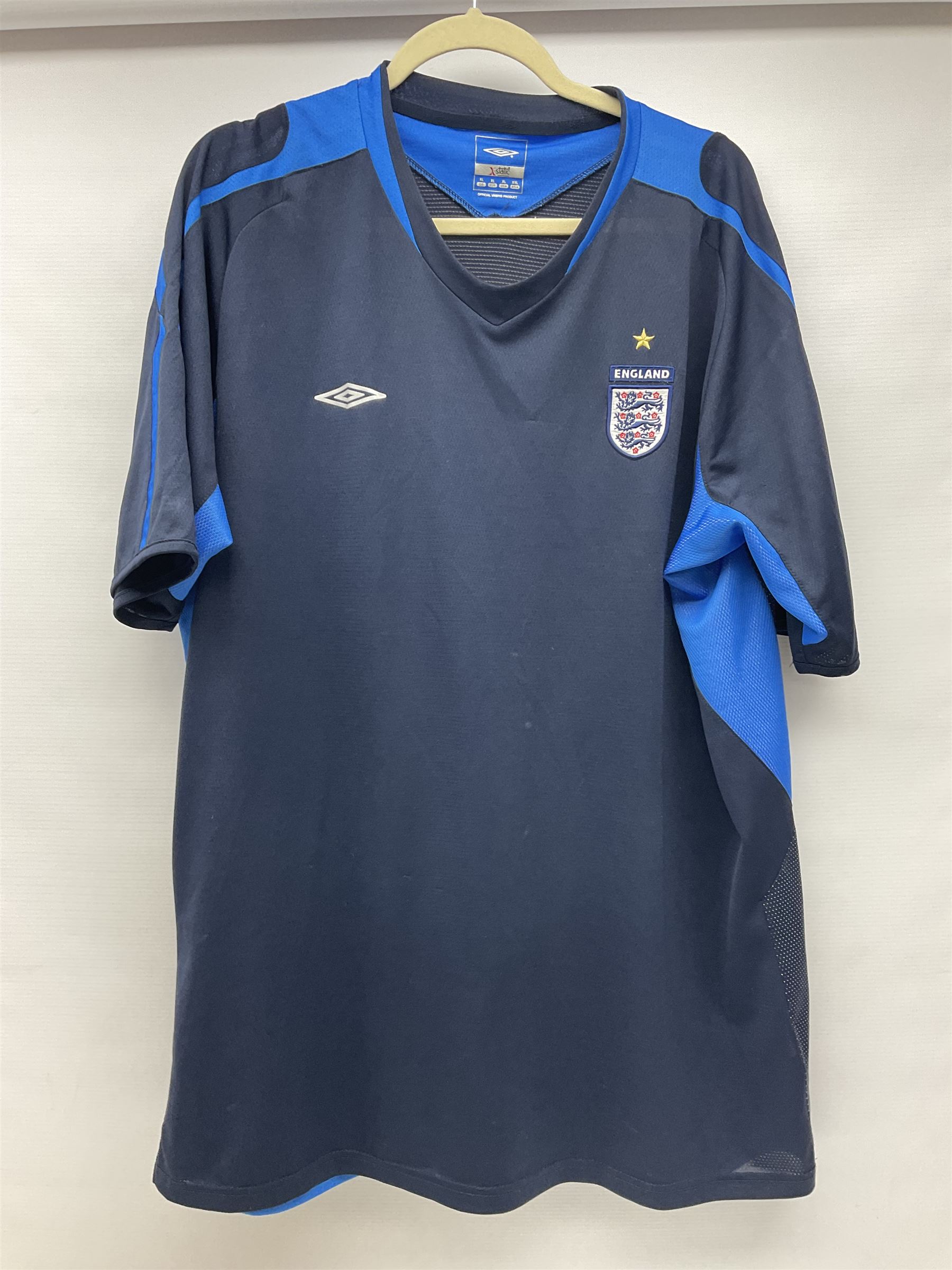 Fourteen items of replica sporting clothing including Leeds United football club shirts, England jerseys etc
