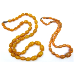  Two early 20th century amber type bead necklaces   