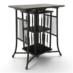 Edwardian black painted side table with incorporated revolving bookcase, supported on barl...
