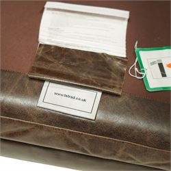 Tetrad - late 20th century leather armchair, upholstered in brown leather with a gently curved back and rolled arms, loose seat cushion over a padded base, raised on turned wooden feet