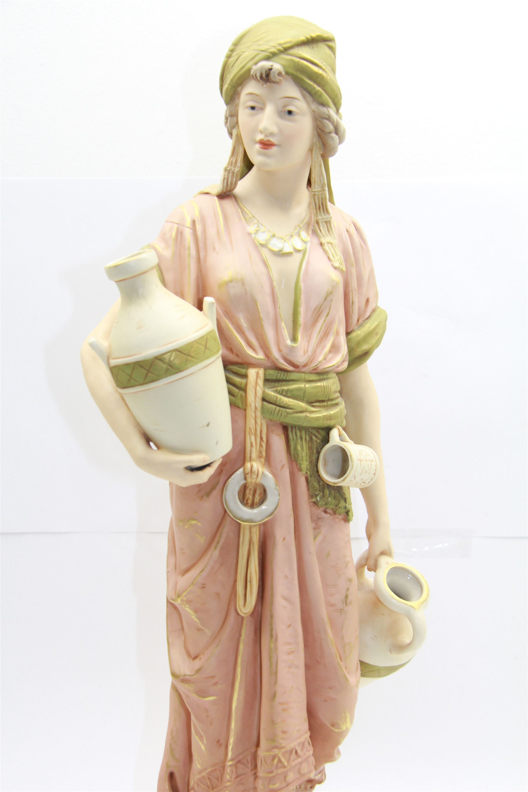 Royal Dux figure no. 686, modelled as a female water carrier, carrying two urns and wearing flowing green and pink robes, with applied pink triangle mark beneath, H61cm