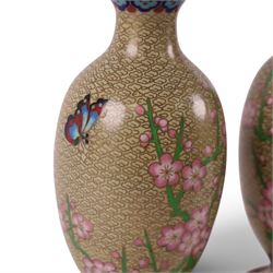 Pair of Cloisonné vases decorated with cherry blossom and peonies, upon a carved hardstone wooden base, H24cm 