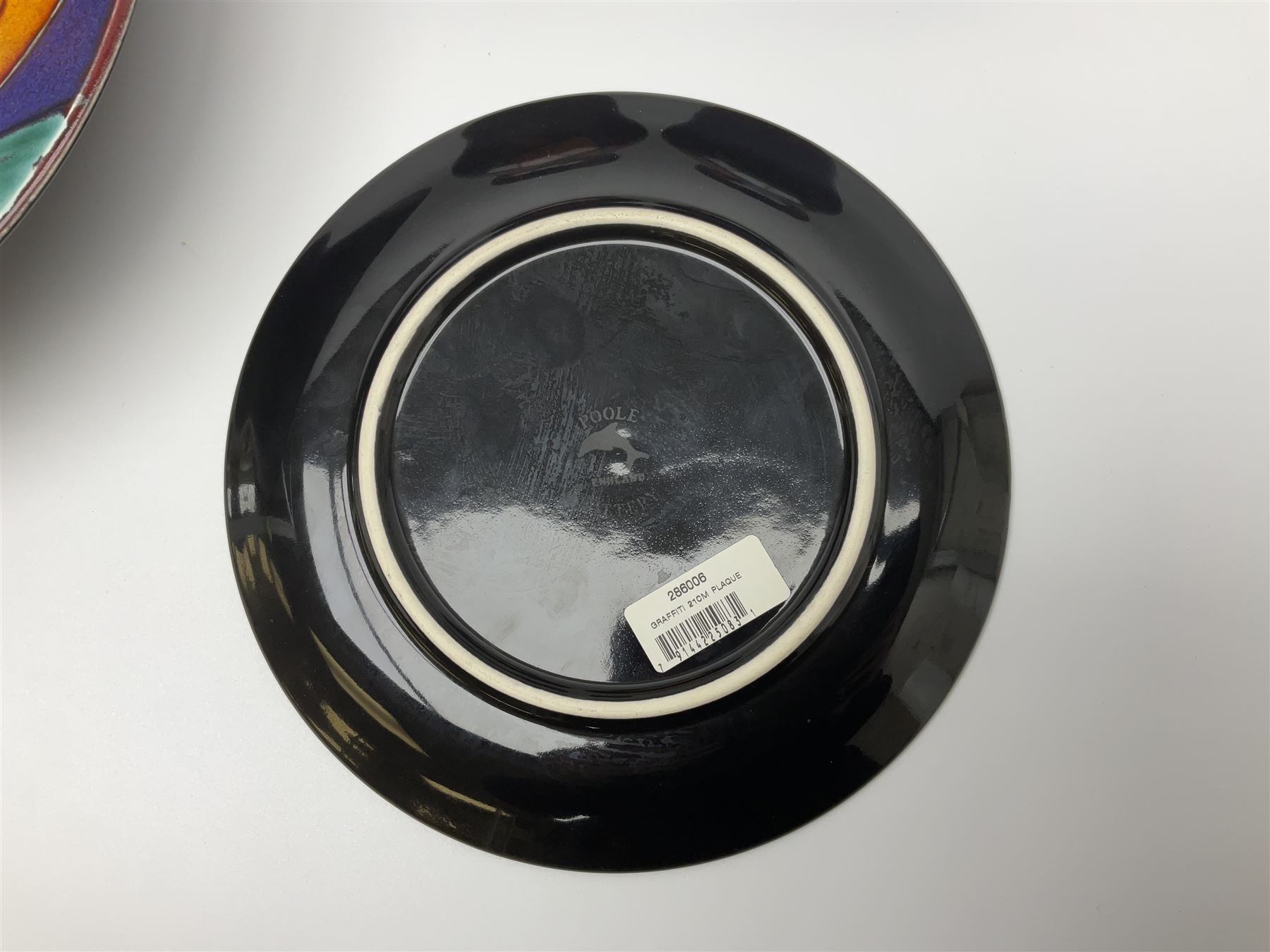 Four pieces of Poole Pottery in Graffiti pattern, comprising pair of vases of baluster form, dish and small plate, with impressed or printed marks beneath, vase H17cm