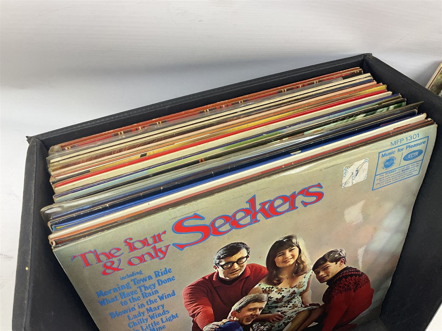 Large quantity of vinyl LPs, predominantly rock and pop, to include Elvis, Elton John, The Kinks, Deep Purple, Eurythmics, Whitney Houston, Phil Collins, Rolling Stones etc, in three boxes, together with quantity of 45 rpm records, Steepletone SRP1R-11 record player and record carry case