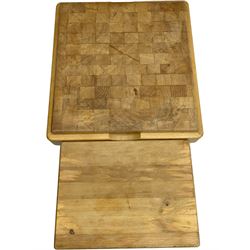 Beech butcher block kitchen cart, featuring square butcher block top, side drop-leaf extension, single drawer with metal sides, and two slatted shelves below, the cart supported by four castors