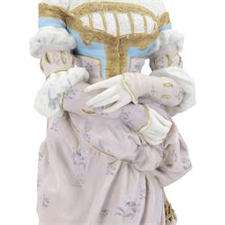Large late 19th century French bisque figure, in the manner of Jean Gille, modelled as a female figure in high neck floral gown and bonnet, upon a naturalistically detailed circular base, overall H65.5m