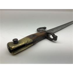 French 1874 pattern epee gras bayonet, the 52cm T section steel blade marked to the spine for the St Etienne arsenal 1877, the hilt with brass pommel, wooden grips and rivets, 84508 stamped on quillon, overall length 64cm