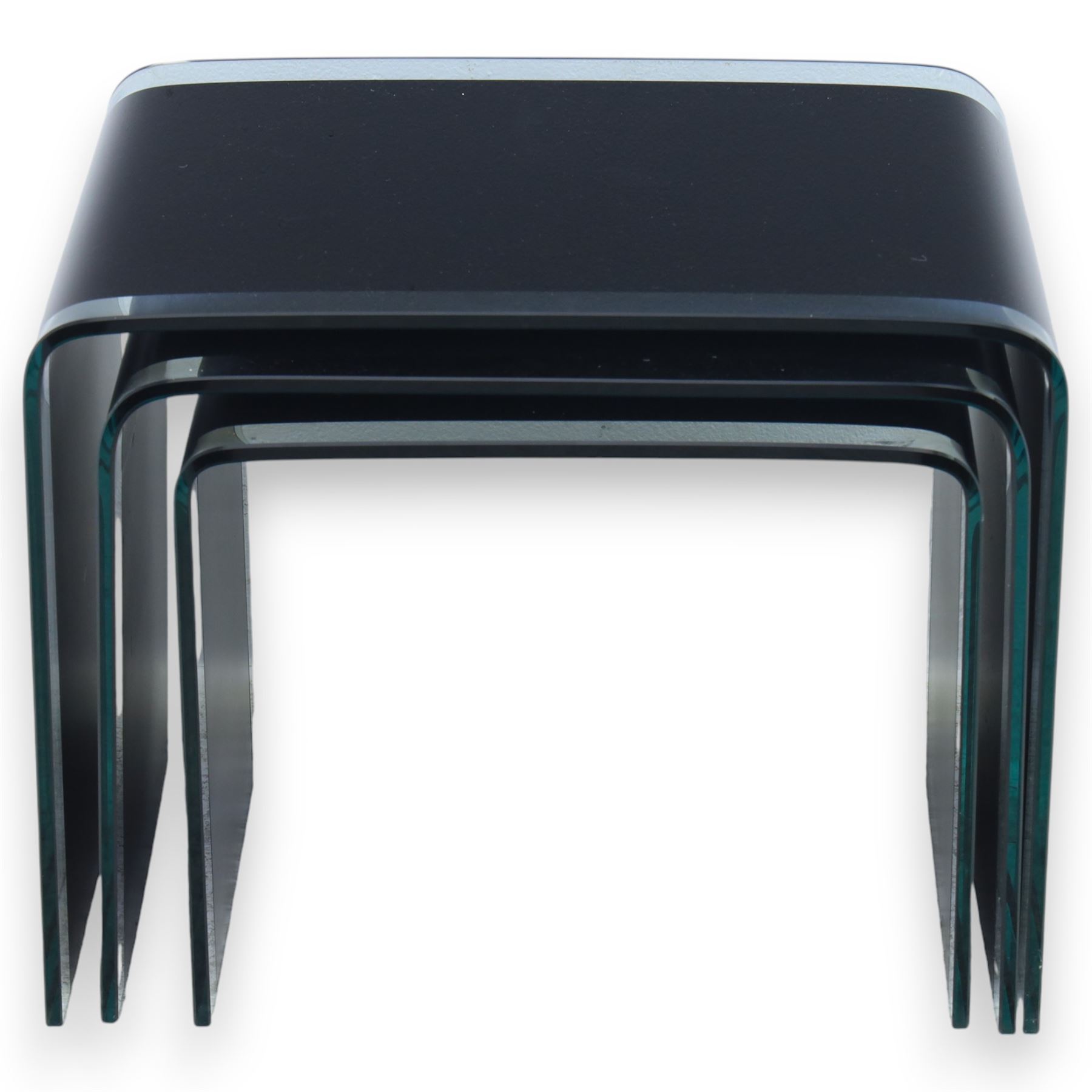 Nest of three contemporary glass occasional tables, black glass centres with  clear glass borders 