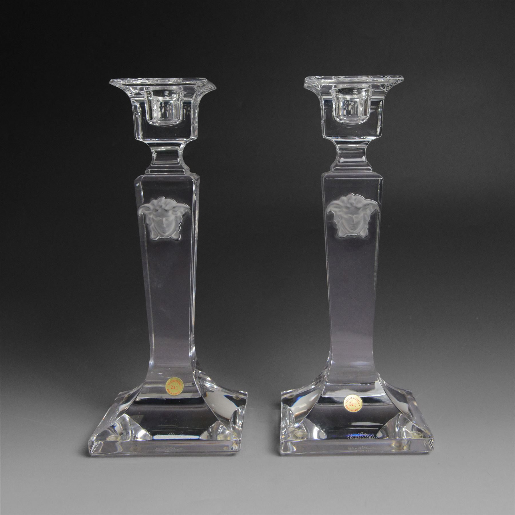 Rosenthal Versace pair of glass candlesticks, of square form, with candles and in original box, H25cm
