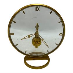 Jaeger Le Coultre- 8-day  Art Deco style circular skeleton clock c1960, gold plated case with translucent dials to the front and rear displaying the 16 jewelled Swiss movement and lever balance. Wound and set from the rear.