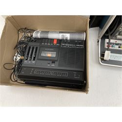 Kodak Carousel S-AV 2020 and 2050 35mm slide projectors, Kodak S-AV cassette recorder 200, Kodak S-AV programmable dissolve control, two Kodak slide carousels and a metal stand; a Singer Graflex 16 cine projector, two 16mm Charlie Chaplin film reels with sound 'Between Showers' and 'Oh What a Night', and five film spools; freestanding roll-up projection screen, and a wood framed reflective daylight projection screen