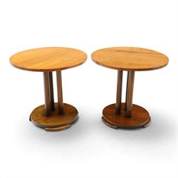 Pair of early 20th century oak lamp tables, circular tops raised on cluster-column pedesta...