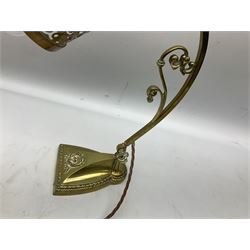 Brass adjustable wall light with a pierced shade and scroll decoration, L37cm 