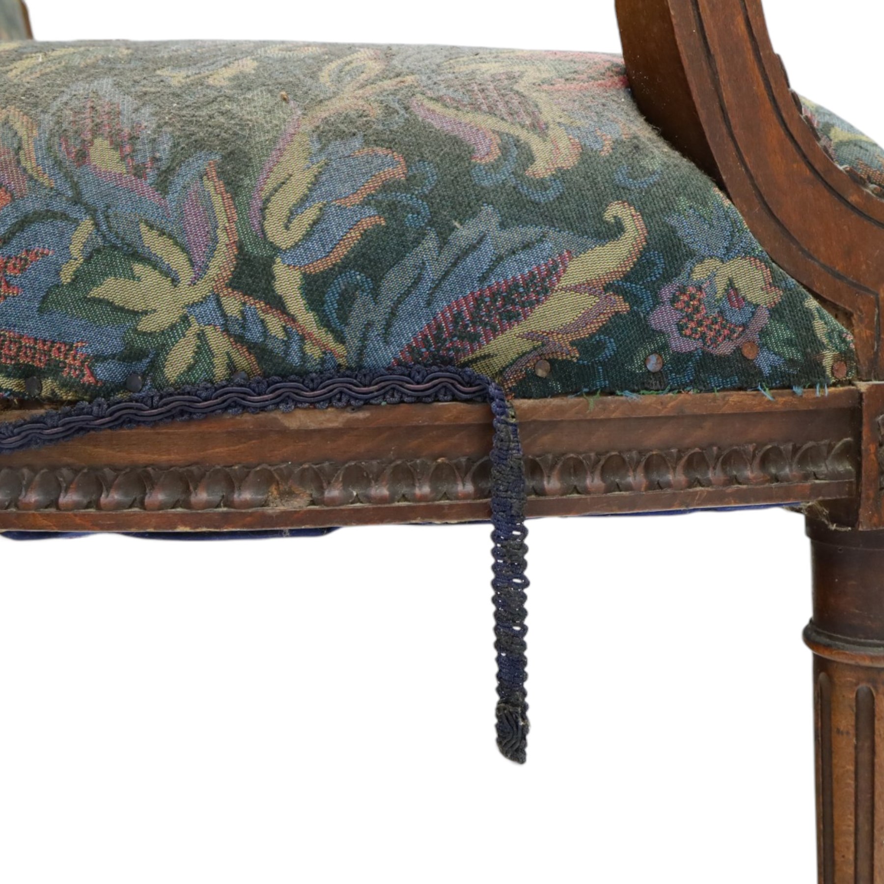 20th century French Louis XVI style stained beech two-seat salon settee, rectangular upholstered back and seat in floral tapestry fabric, carved and moulded frame with foliate cresting, padded open arms and fluted tapering supports