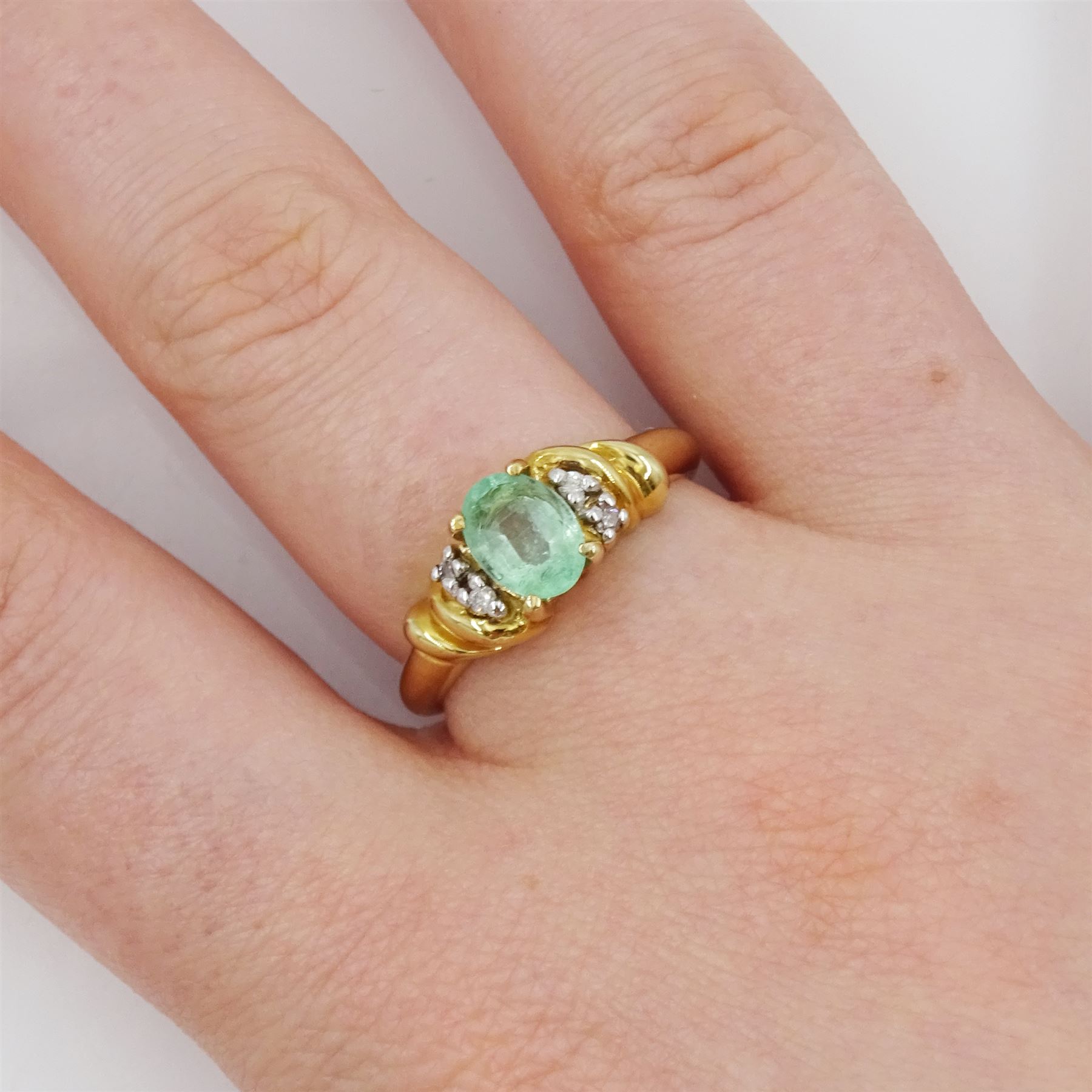 9ct gold five stone oval cut emerald and diamond ring, hallmarked, emerald approx 0.60 carat