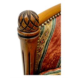 Pair of cherry wood framed tub-shaped armchairs, upholstered in striped floral fabric with brass stud trim, carved walnut frame with fluted supports capped with pinecone finials, on turned feet