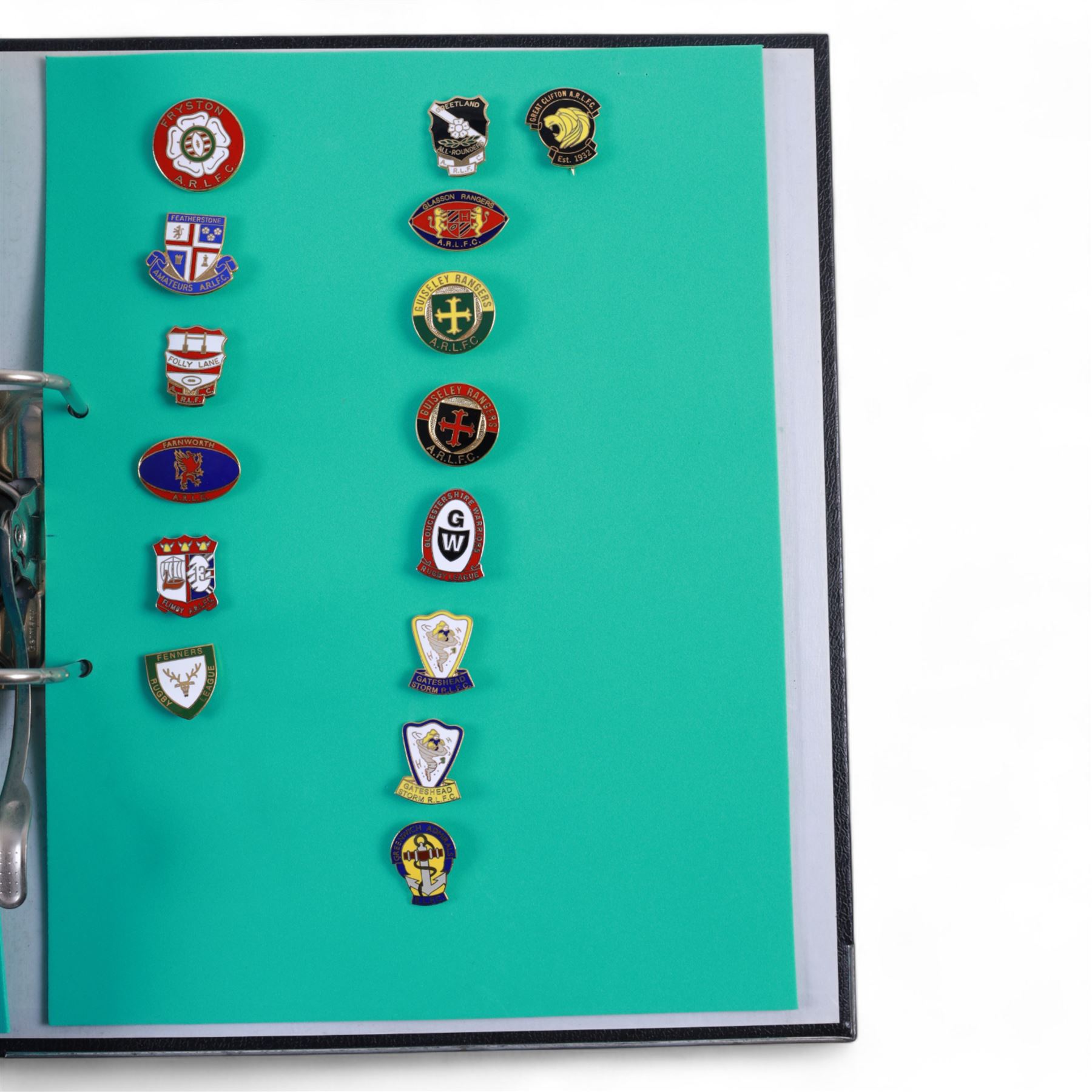 Amateur rugby league enamel badge collection, teams including Birmingham Bulldogs, Bridlington, Dudley Hill, Duke of York, Edinburgh Eagles, Guiseley, Rangers, Huntingdon, Keighley Town, Leigh Miners, Pilkington Recs, St Josephs, Thornhill Trojans, West London Sharks etc, all displayed in three folders and six amateur league badges from Leeds & District, Hull & District, York & District, Warrington, Lancashire County and Yorks County in box display, (approximately 270)