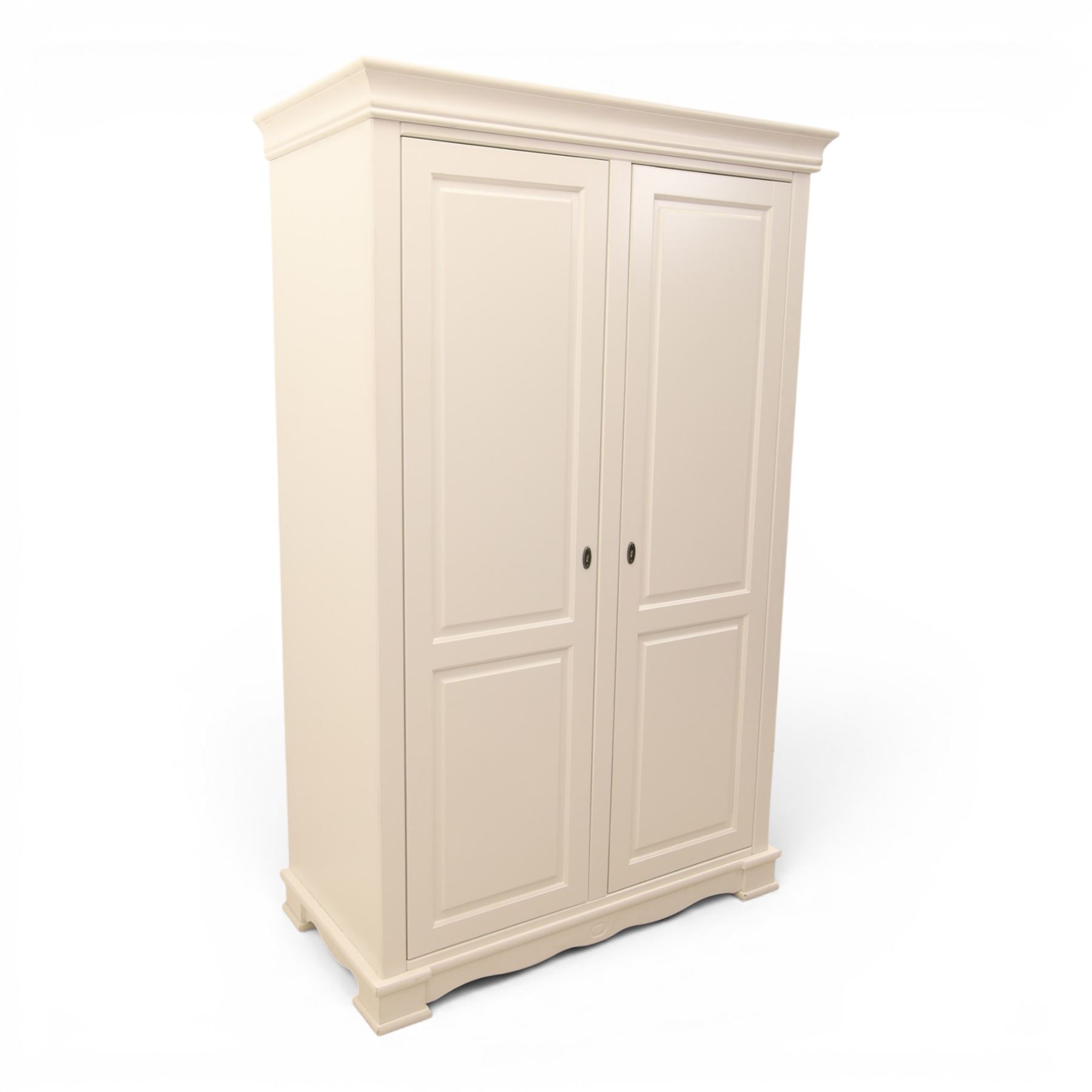 Modern white painted double wardrobe, fitted with two panelled doors, enclosing a hanging rail and shelving, raised on bracket feet