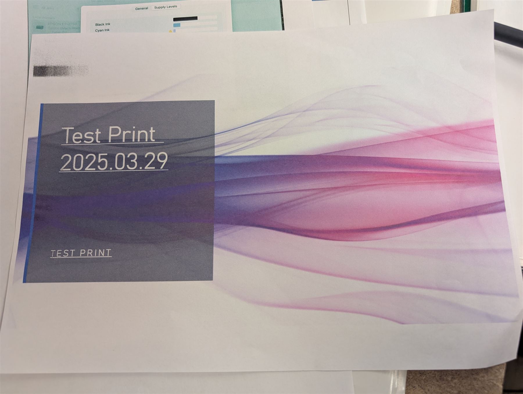 Epson ET-2750 ecotank printer, boxed with a collection of printing paper including photographic paper and postcards