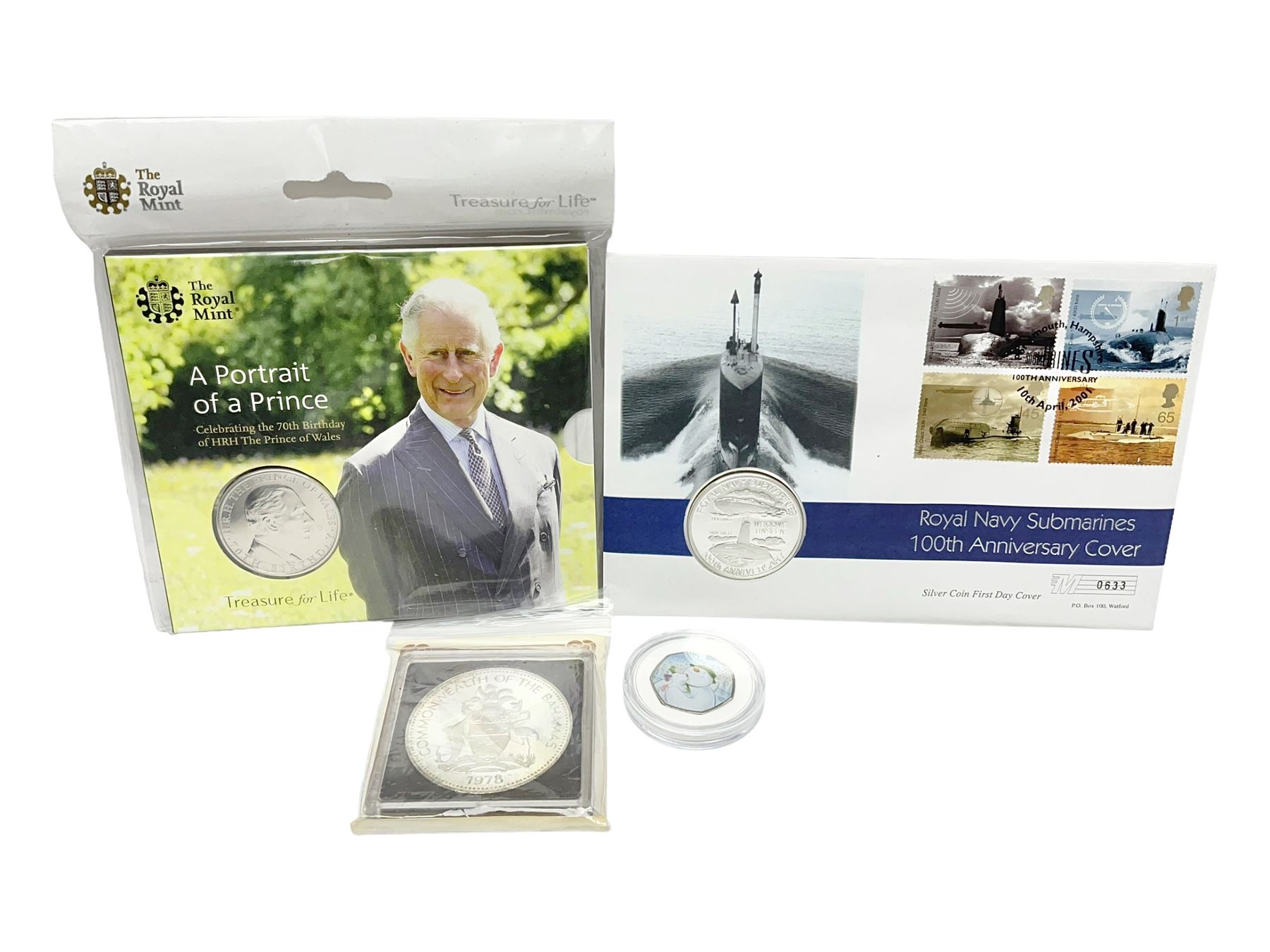 Commonwealth Of The Bahamas 1978 silver proof ten dollars coin with certificate, Queen Elizabeth II Turks and Caicos Islands silver twenty crowns coin in commemorative first day cover, The Royal Mint United Kingdom 2018 'Celebrating the 70th Birthday of HRH The Prince of Wales' five pound coin in card folder and 2022 The Snowman and The Snowdog coloured fifty pence coin