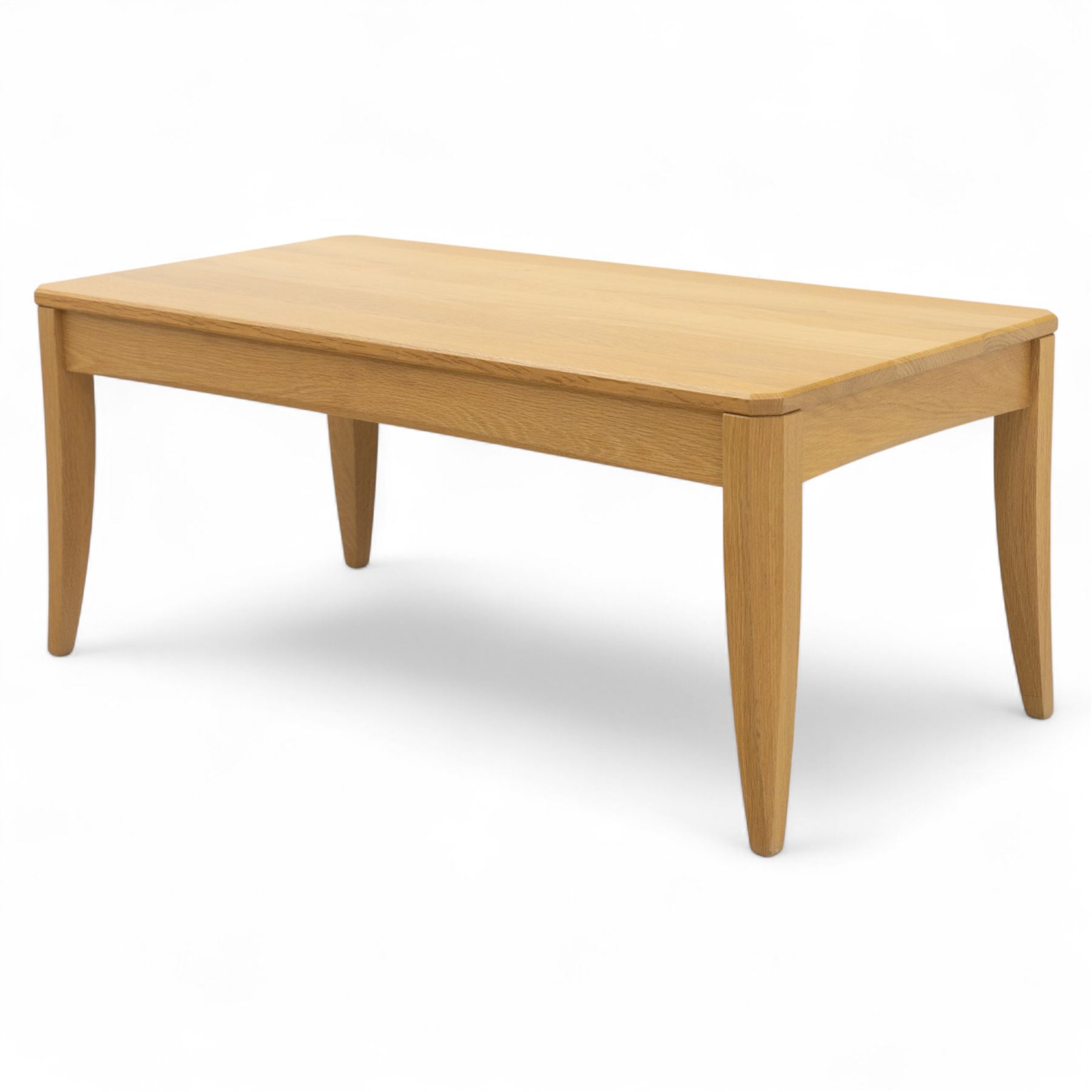 Ercol - light oak ‘Artisan’ coffee table, of rectangular form with chamfered top and gently tapered legs