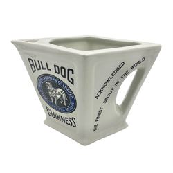 Royal Doulton Guinness advertising whiskey water jug, circa 1930s by Robert Porter and Co. of lozenge angled form, decorated with the  bulldog Guinness, H11cm