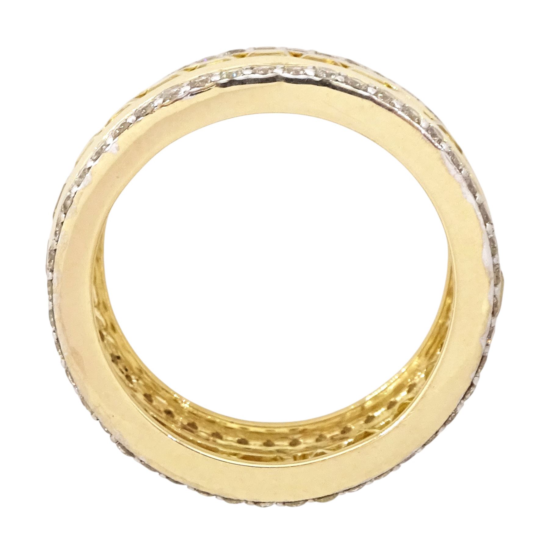 Gold yellow sapphire and diamond three row full eternity ring, channel set calibre cut sapphires, with a row of round brilliant cut diamonds set either side, stamped 9K, total sapphire weight approx 2.95 carat, total diamond weight 0.85 carat