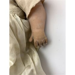 Seyfarth & Reinhardt composition head baby doll with moulded hair, sleeping flirty eyes, open mouth with one tooth and tongue and soft body with composition jointed limbs, marked 'SuR Germany 30/5' H47cm; together with a Golborne Dolls 'Golborne Beauty' composition head and body bride doll, marked 'F.P.23' in original box H63cm (2)