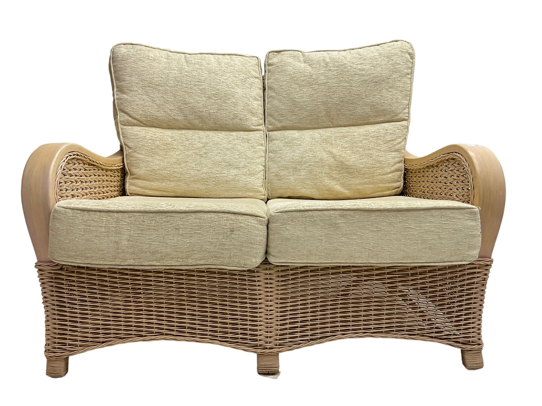 Contemporary rattan conservatory suite - two seat sofa with wicker frame and loose cushions upholstered in textured champagne fabric (W125cm H98cm); pair of matching armchairs (W72cm H98cm); rectangular glass-topped coffee table with rattan frame and undertier (W85cm D60cm H47cm); and matching square side table (W53cm H55cm)