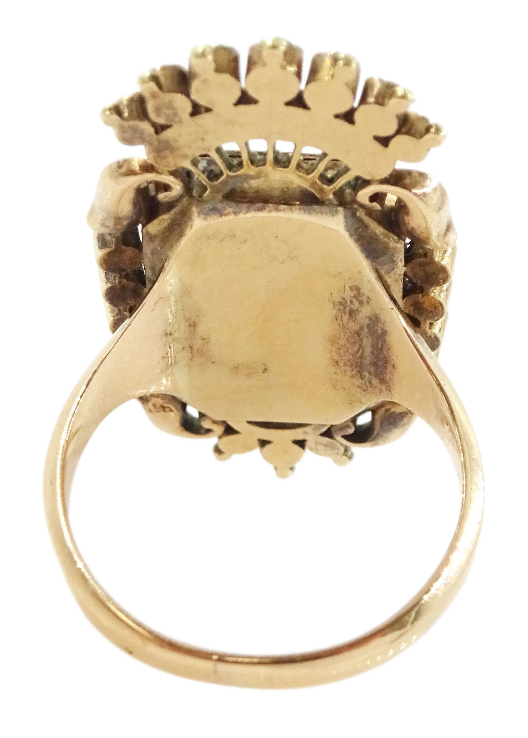 19th century 18ct gold portrait ring, set with an octagonal miniature of a woman wearing a pink dress on ivory, under a glazed panel, within a milled bezel and garnet surround, surmounted by a coronet set with seed pearls and further garnets. This lot has been registered for sale under Section 10 of the APHA Ivory Act