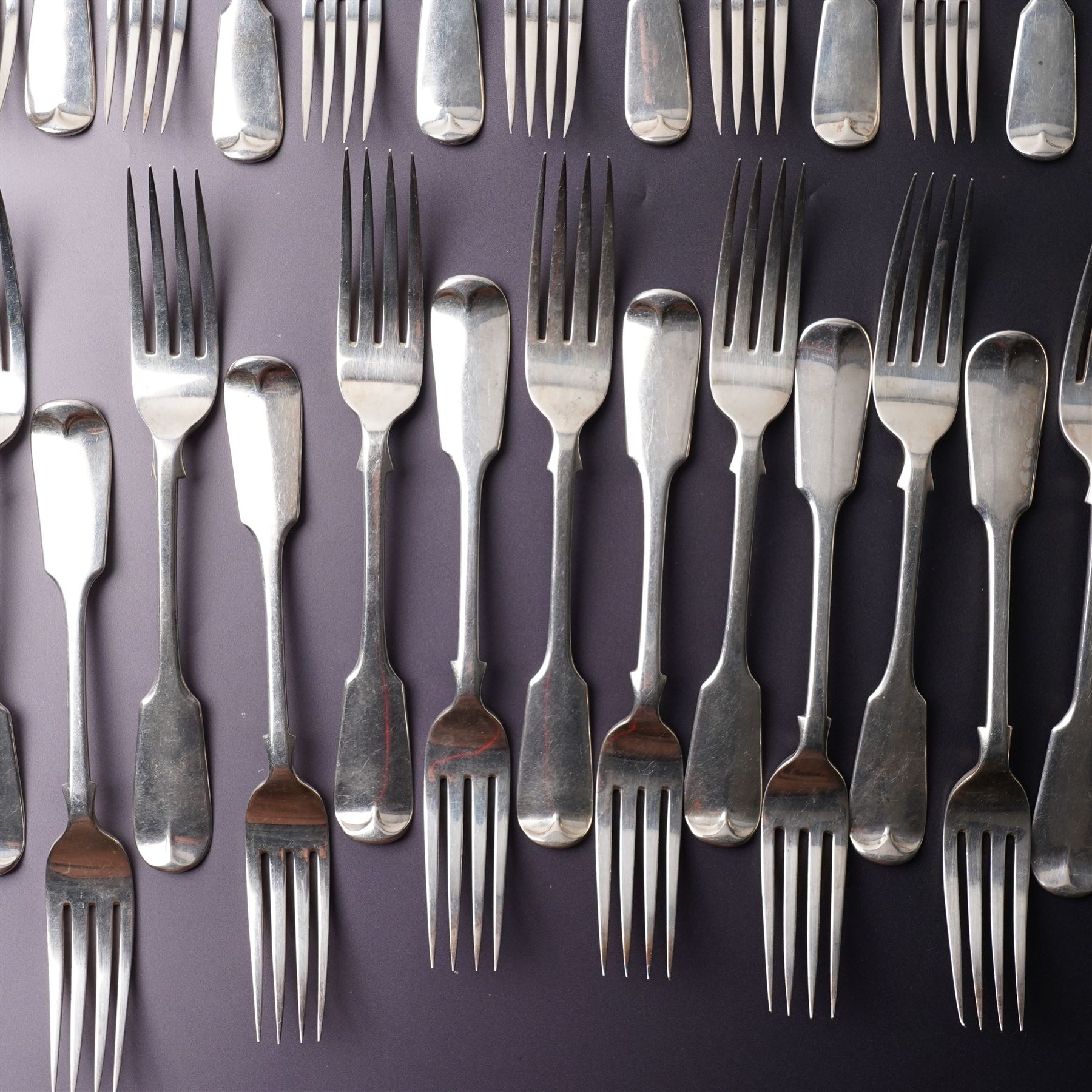Suite of Victorian silver fiddle pattern cutlery comprising eighteen table forks, seventeen dessert spoons, fifteen dessert forks and three table spoons London 1856 Maker A B Savory & Sons
