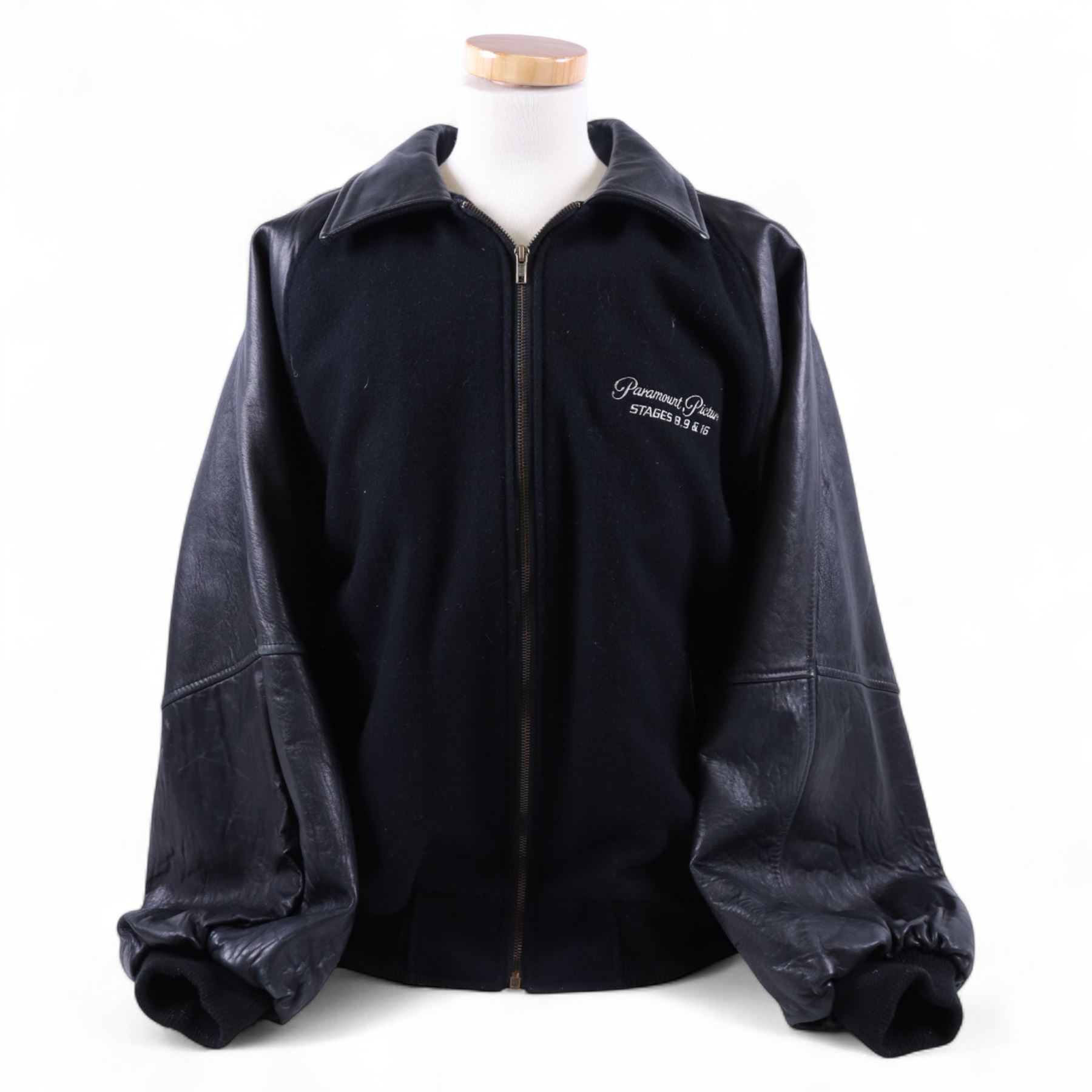 Star Trek The Next Generation 10th anniversary jacket, leather sleeves and collar with embroidered decoration throughout, including 10th anniversary emblem to back, 'Star Trek The Next Generation' to collar, 'Paramount Pictures Stages 8,9 & 16' to front and seven character names to interior, in size XXXXL, purchased in 1990s from Star Trek Experience Las Vegas