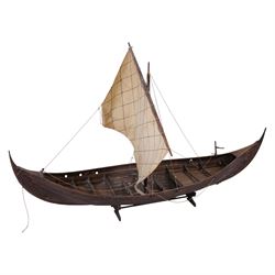 Three wooden model ships, comprising a single mast Schooner style pond yacht, a kit-built Viking longship and a model of HMS Endeavor, Schooner H117cm