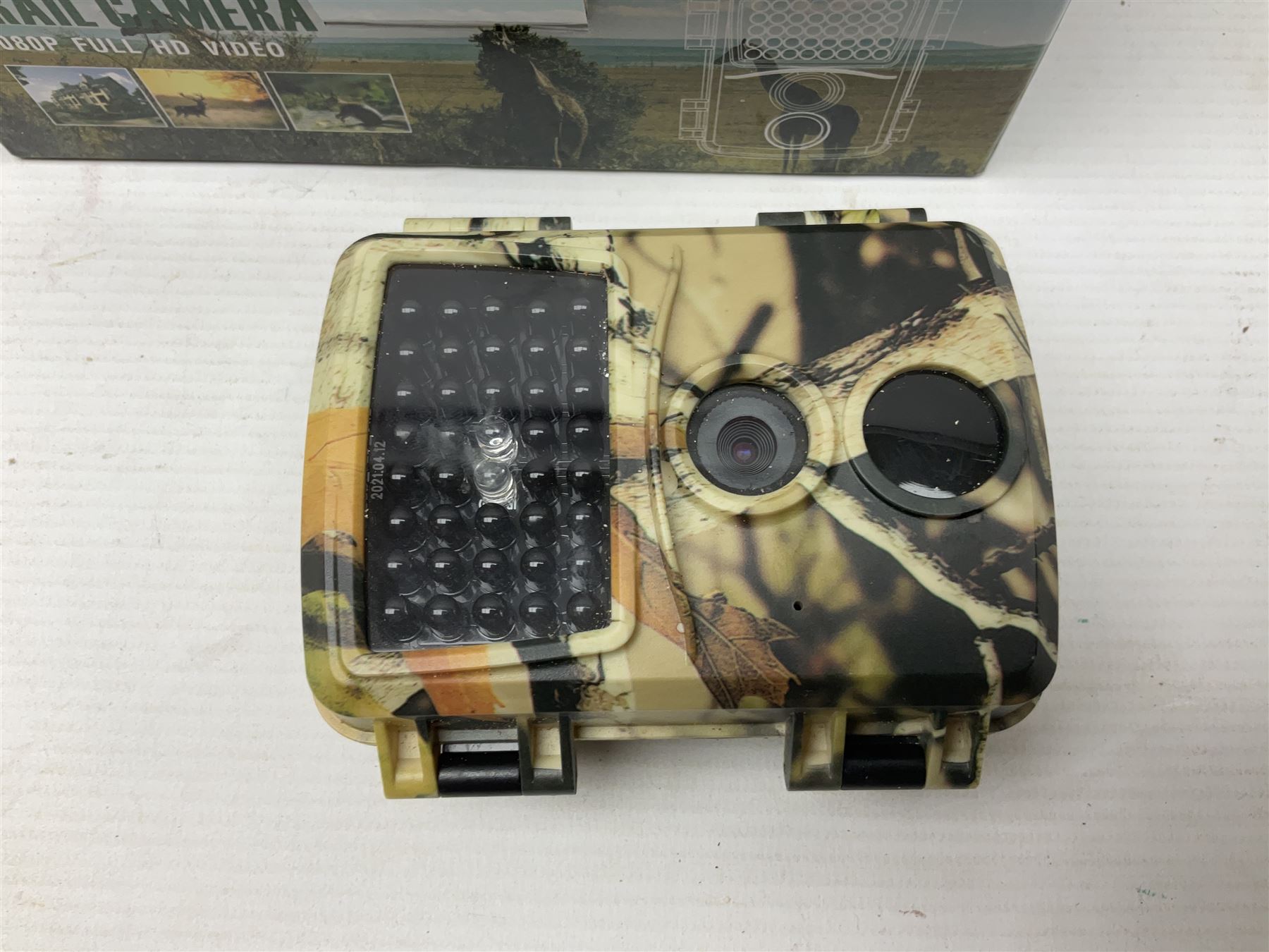 Four shooting accessories - Riflescope 3-9 x 50 scope; Digital Trail Camera; Megaorei M3 night sight add on; and Logan Gun Lamp; all boxed (4)