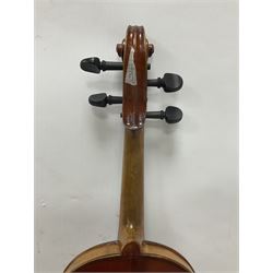 Copy of a full size Stradivarius violin, with an ebonised fingerboard, tailpiece and tuning pegs Length 60cm
