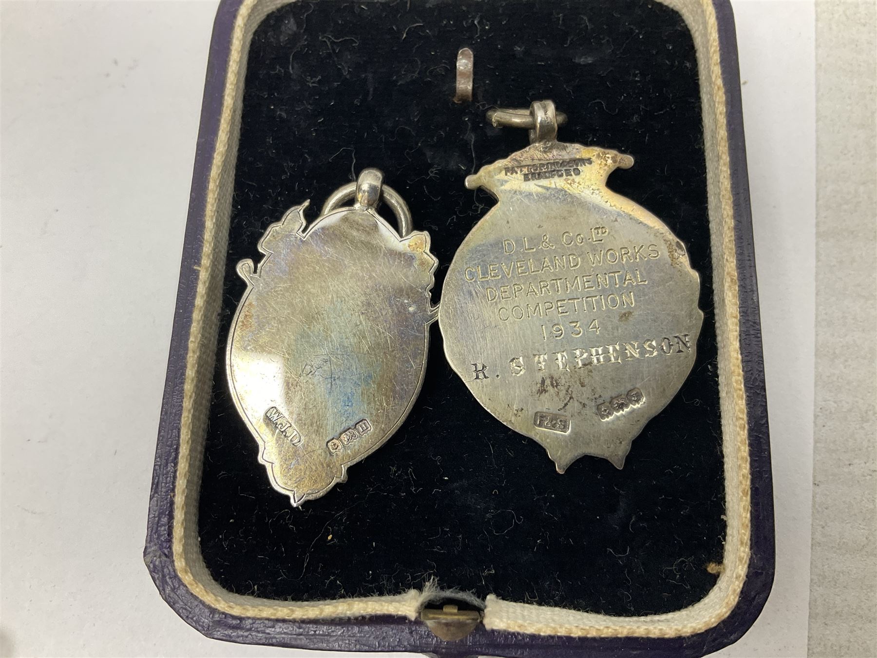 Four St John's silver fobs, together with two silver Directors Ambulance shield fobs and two other St Johns items 